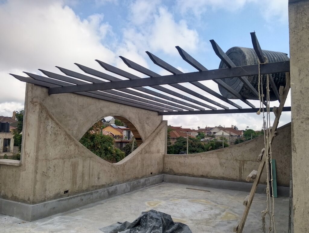 Roofing & External Skin. Application of APP waterproofing and Ndarugu stone cladding.